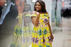 A beautiful African lady, from a Nigerian decent posing for a photograph wearing her DIY made African print dress made with Ankara fabrics